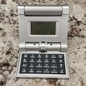 Travel calculator clock world time calendar alarm